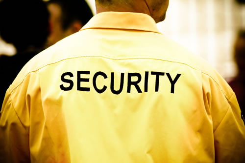 Picture of man wearing jacket with security on back