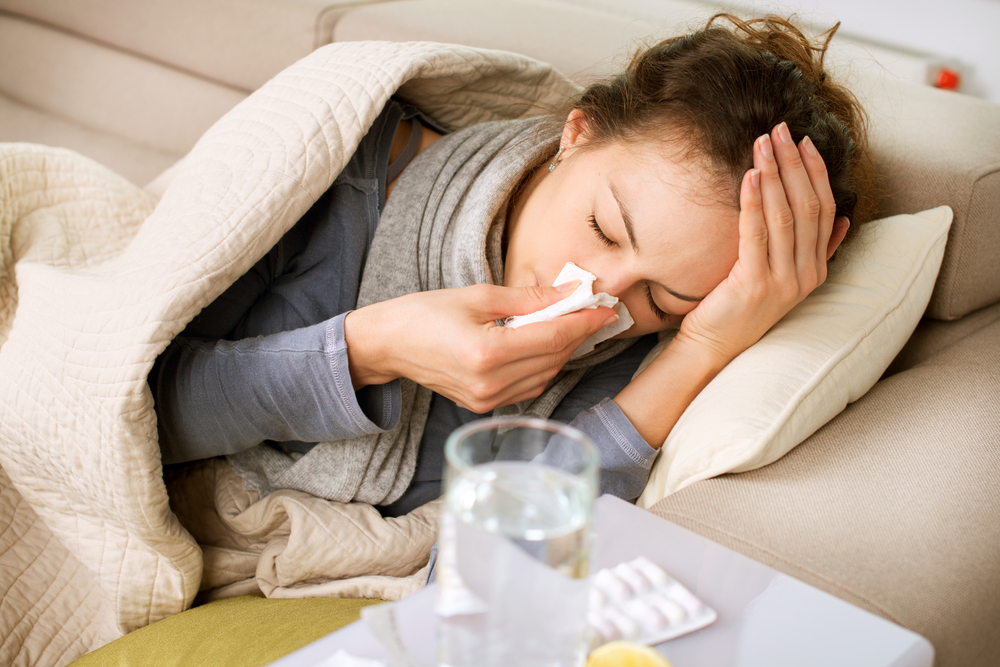 Woman blowing nose